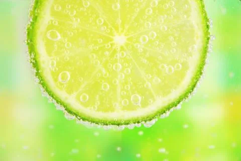 Close-up of a lemon slice with bubbles Stock Photos