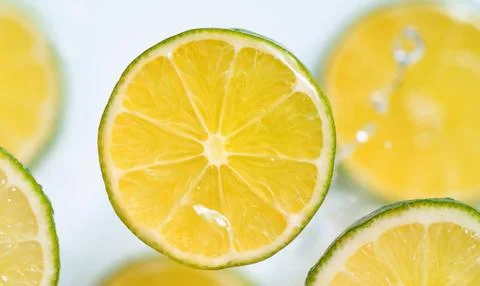 A close-up of a lemon slice floating in water Stock Photos