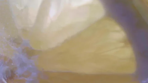 Close-Up of Lemon Slices in Glass Being Filled with Lemonade Video stock 330188980