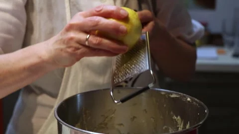 Close Up of Lemon Zesting Over Mixing Bowl During Baking Process Stock Footage 298167322