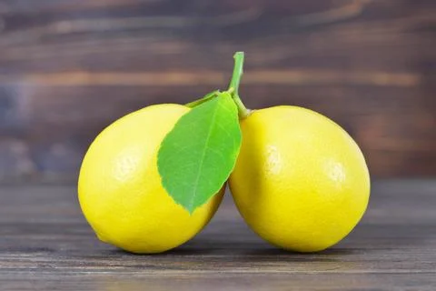 Close up of lemons on wooden background Stock Photos