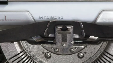 Close up LENINGRAD SOVIET UNION being typed on vintage typewriter Stock Footage 185146796