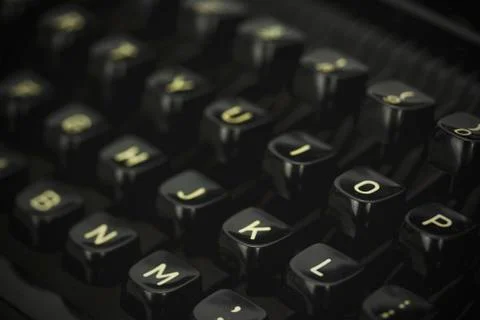 Close up of lettered keys on an old typewriter. Vintage filter applied. Stock Photos