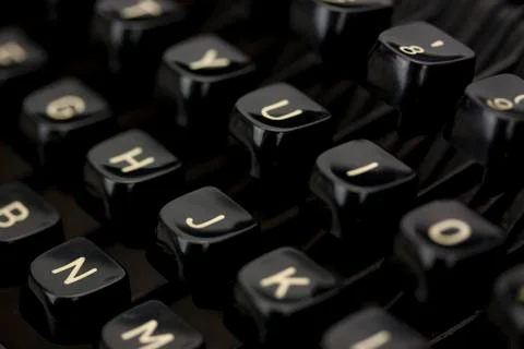 Close up of lettered keys on an old typewriter. Stock Photos