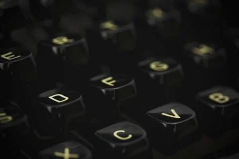 Close up of lettered keys on an old typewriter. Vintage filter applied. Stock Photos