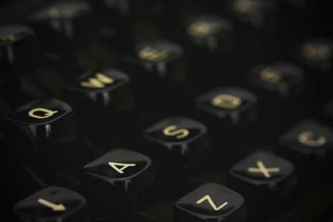 Close up of lettered keys on an old typewriter. Vintage filter applied. Stock Photos