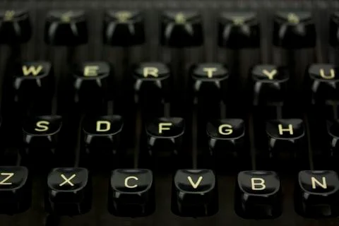Close up of lettered keys on an old typewriter. Stock Photos