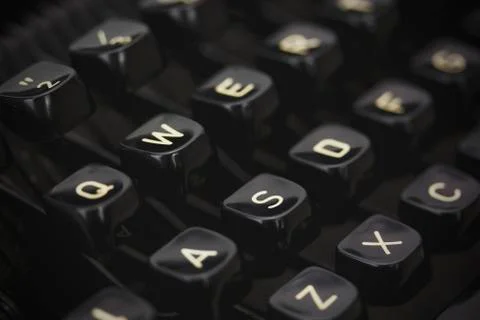 Close up of lettered keys on an old typewriter. Vintage filter applied. Stock Photos