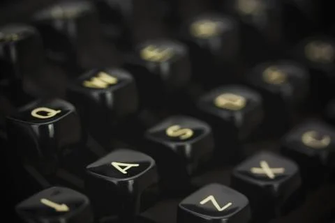Close up of lettered keys on an old typewriter. Vintage filter applied. Stock Photos