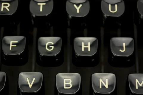 Close up of lettered keys on an old typewriter. Stock Photos