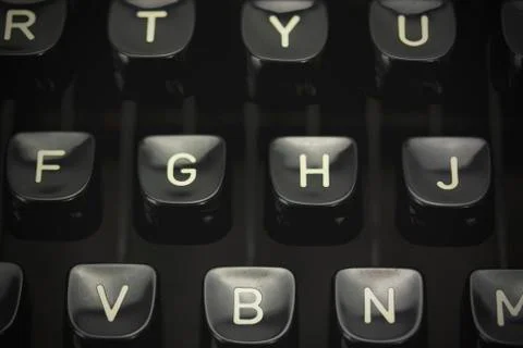 Close up of lettered keys on an old typewriter. Vintage filter applied. Stock Photos
