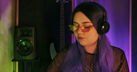 Close-up of LGBTQ non-binary Dj musician vibing while writing hip-hop beats Stock Footage 157735016