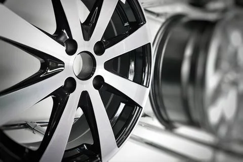 Close-up of light alloy wheels designed for passenger cars on display at a store Stock Photos