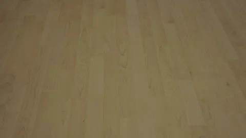 Close up of light beige parquet or vinyl floor made from ash planks in empty Stock Footage 268786476