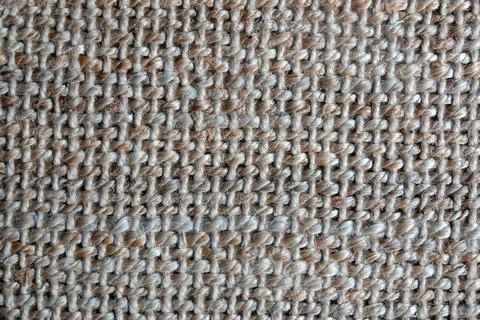 Close-up of light brown carpet texture background. Fragment of large weaving Stock Photos