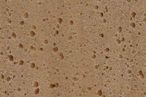 Close-up of a light brown textured surface with numerous small, round, dimple Stock Illustration
