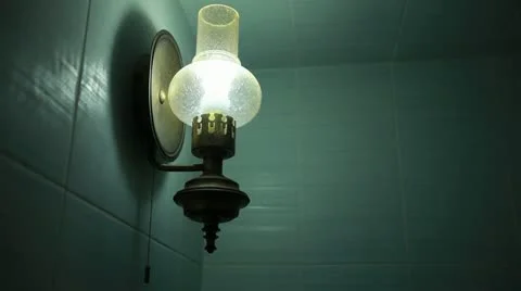 Close up of light bulb being switched off Stock Footage