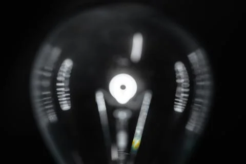 Close-up of light bulb bokeh in a black background. Stock Photos