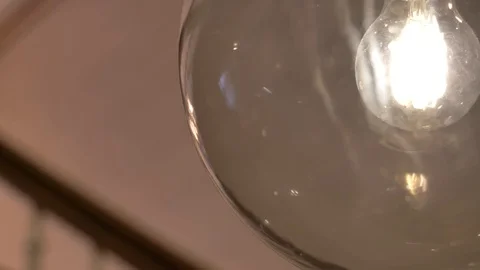 Close up light bulb incased in round glass Stock Footage 116181383