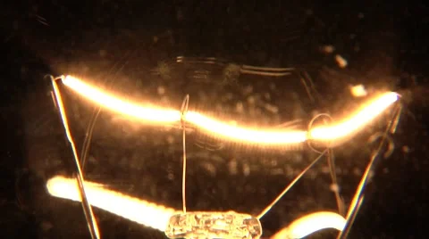 Close up of light bulb turning on and off Video stock 8967820