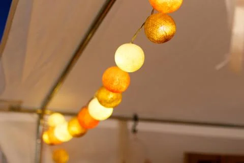 Close up light bulbs of hanging decorative lights string for a party or ceremony Stock Photos