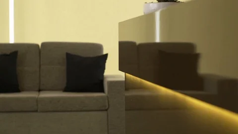 Close up of light up coffee table with sofa and pillows, Portugal Stock Footage 129067528