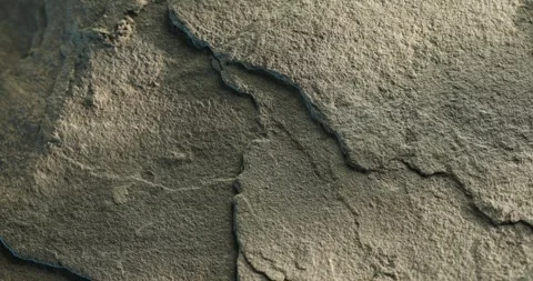 Close-up of light cracked rock surface with layered edges and soft texture Video stock 313180202