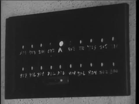 Close up of light glowing on patchboard, 1930s Stock Footage 58858729