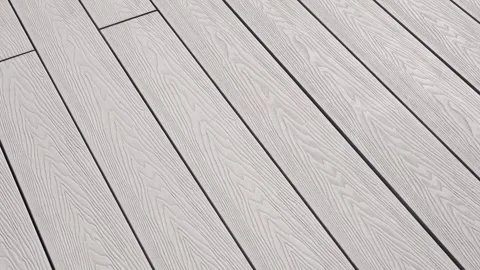 Close-up of light gray composite decking with pronounced wood texture. The surfa Stock Footage 312019095