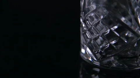 Close Light Swirl Empty Traditional Whiskey Glass Stock Footage 140765596