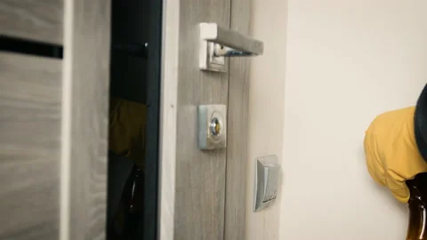 Close up of light switch and door handle wipe with antiseptic. Disinfection from Stock Footage 149967119