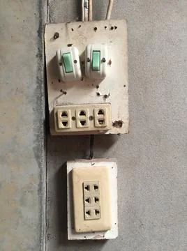 Close up of Light Switch with copy space to the side on wall background. Togg Stock Photos