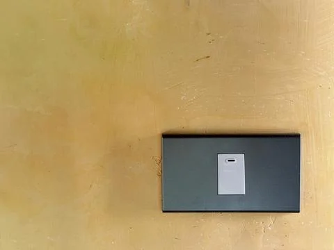 Close up of light switch with copy space on yellow wall Stock Photos