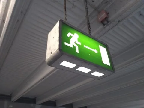 Close up lighted store exit sign Stock Photos