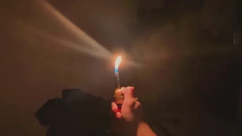 Close up lighter ignition. ignite of gas lighter in a dark Stock Footage 302993994