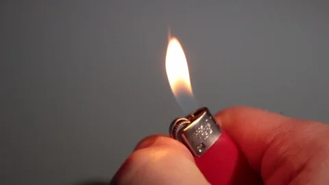 Close up of a lighter that lights up in slow motion Stock Footage 120567603