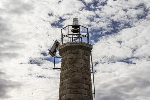 A close up of a lighthouse on a cloudy day Stock Photos