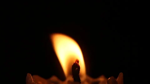 Close-up of a lighting candle  in the dark Video stock 172697248