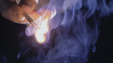 Close-up of lighting matches in the dark Stock Footage 75547156