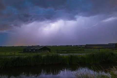 Close lighting strike in farmland Stock Photos