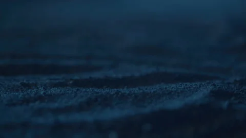 Close-up of Lightning Reflecting Off of Sand at Night Stock Footage 208802088