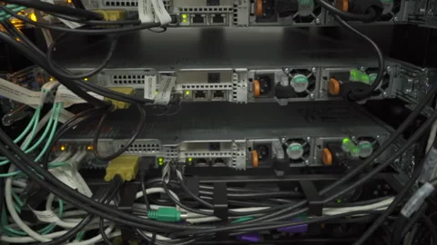 Close-up of lights blinking cloud computing system on rack in server room Pan Stock Footage 141546417