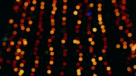 Up close the lights of a Christmas tree, decorated with shiny globes. Stock Footage 145128791