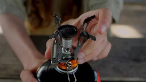 Close-up of a lightweight, compact camping stove on a fuel canister... Stock Footage 322811577