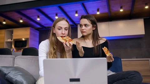 Close up of likable cheerful modern young brunette and blondie which relaxed on Stock Footage 127102508