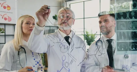 Close up of likable concentrated experienced different ages medical colleagues Stock Footage 160356324