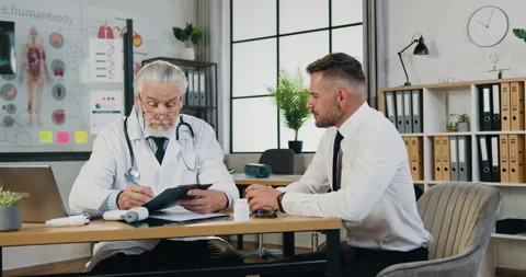 Close up of likable confident bearded man which visiting his respected Stock Footage 160825603