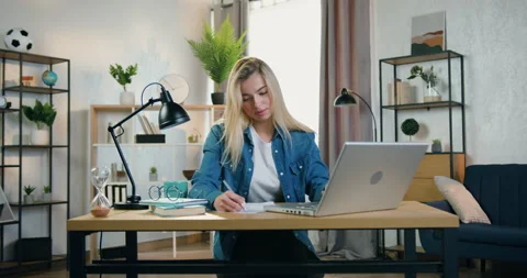Close up of likable confident experienced blond female worker which sitting in Stock Footage 158451792