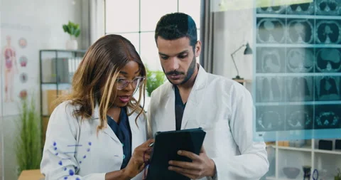 Close up of likable serious high-skilled mixed race two chemists which standing Stock Footage 158107774