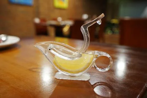 Close up Lime and lemon squeezer on wooden table Stock Photos